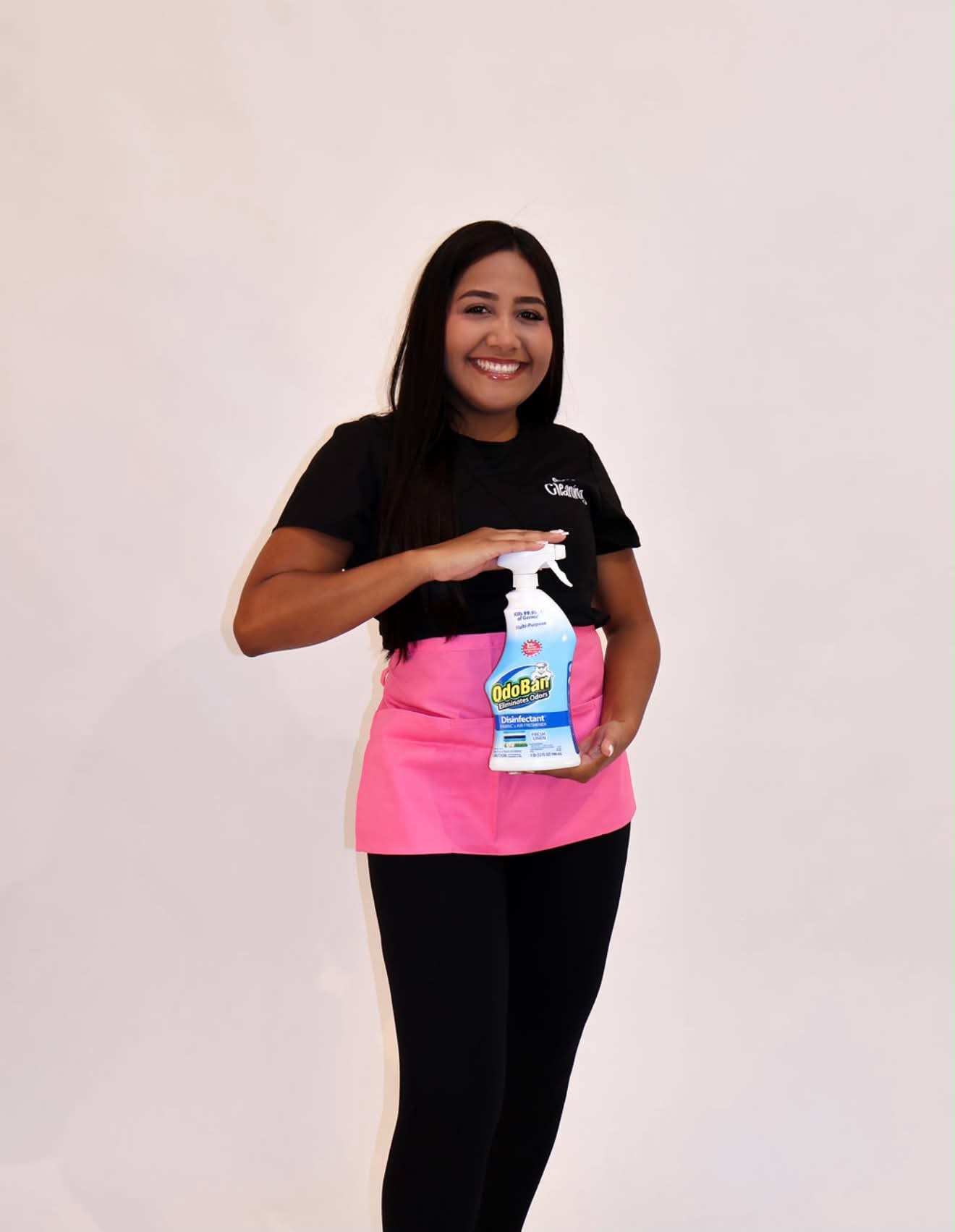 OC Cleaning team member holding cleaning supplies