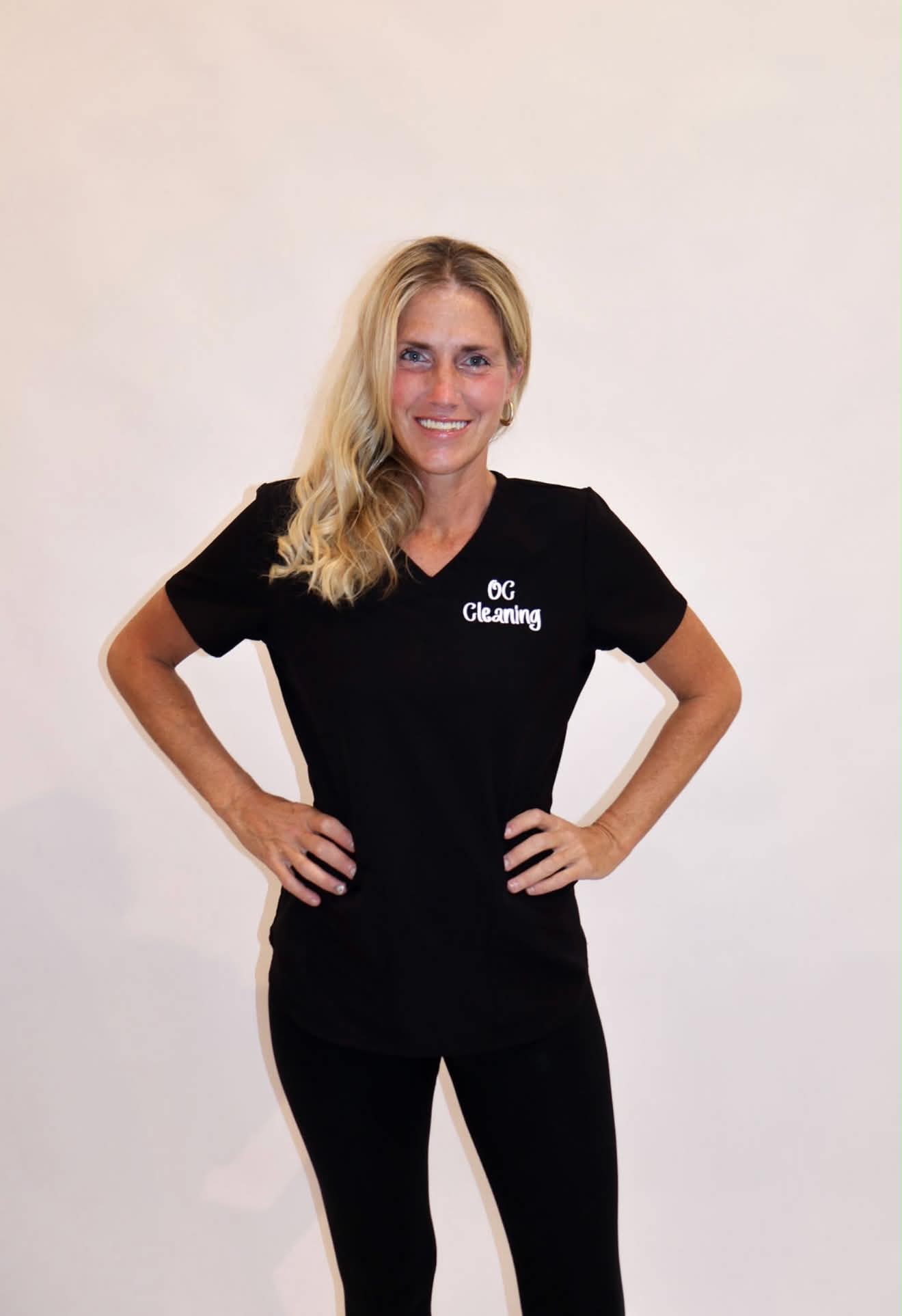 OC Cleaning team member in a black uniform